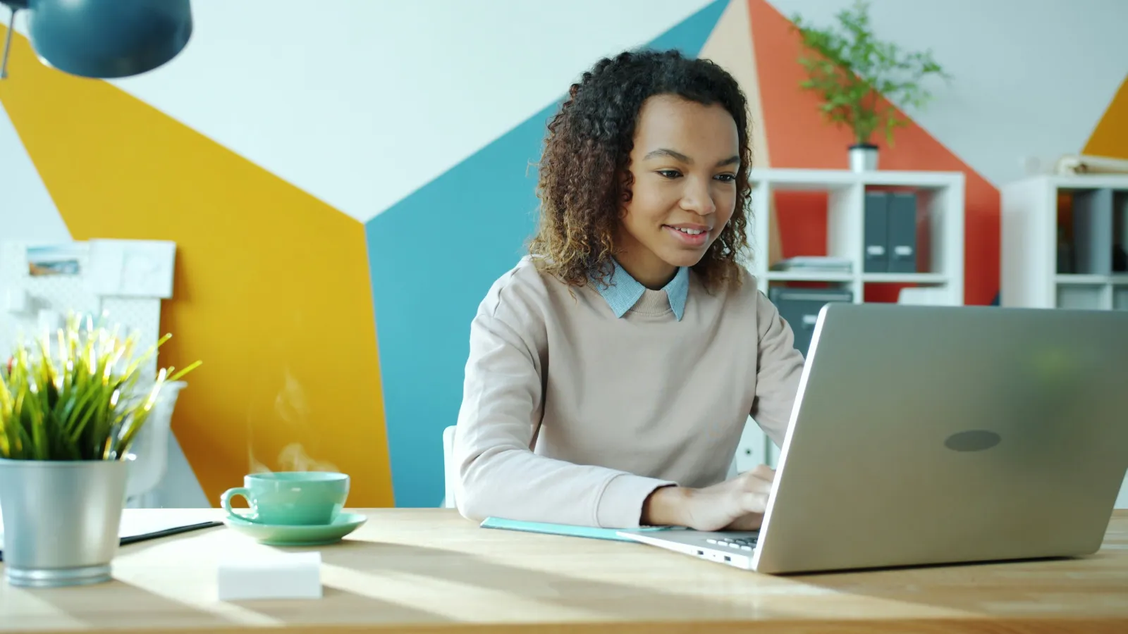 A professional works confidently at her laptop — the KBD Systems way
